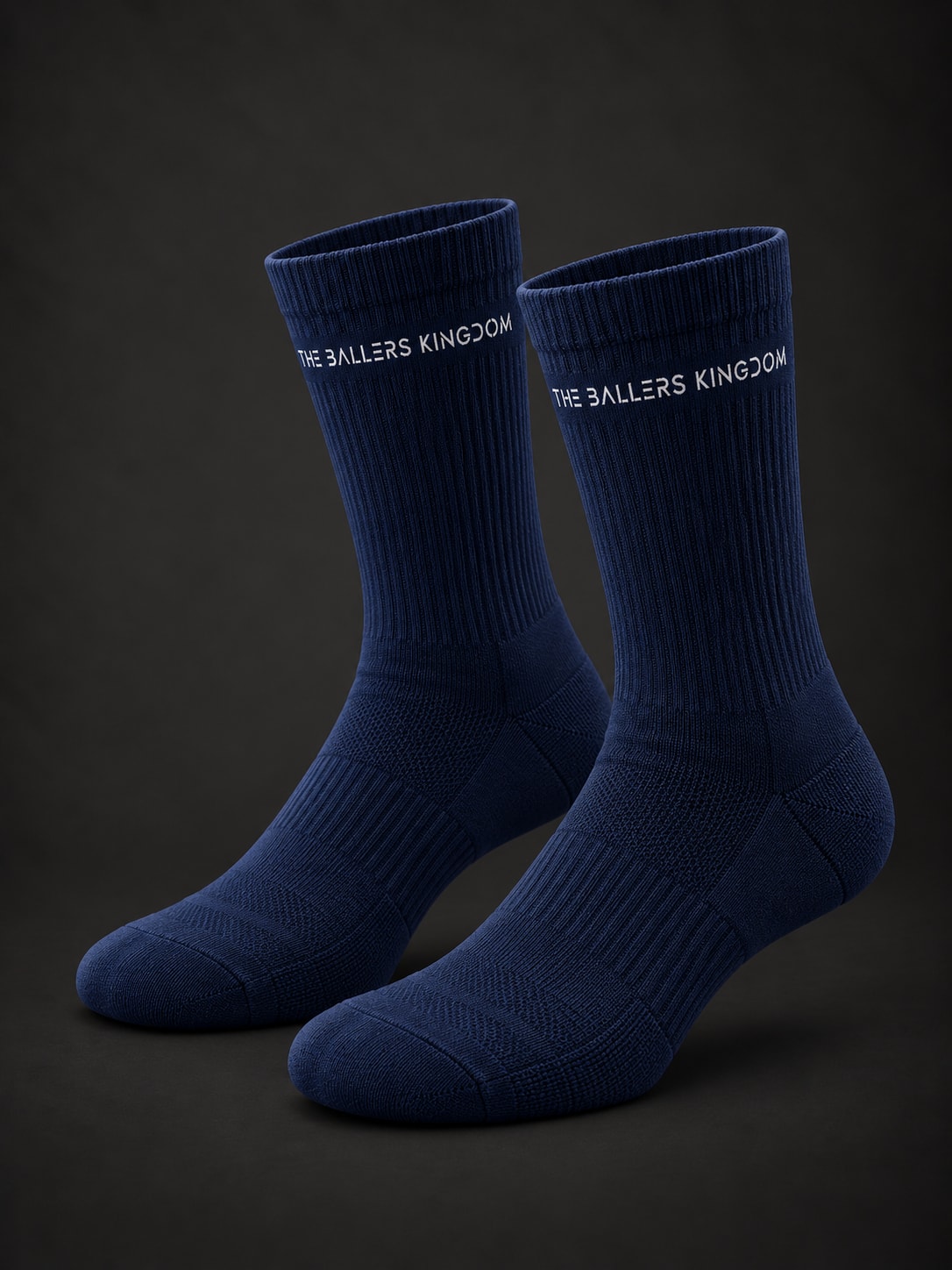 Navy crew socks with clean Ballers Kingdom cuff branding. Ballers Kingdom Socks design mockup.