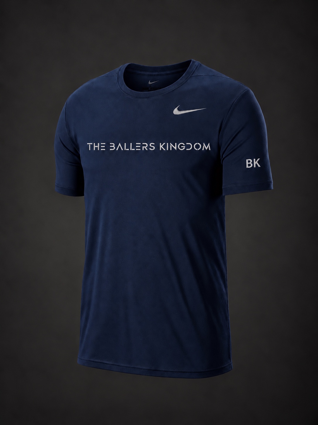 Navy performance tee with The Ballers Kingdom stencil wordmark, Nike swoosh and embroidered BK sleeve initials