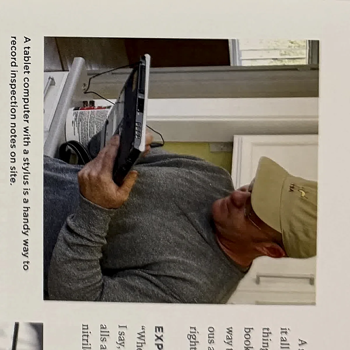 A cropped textbook photo of an inspector taking notes or using a device during an exterior inspection.