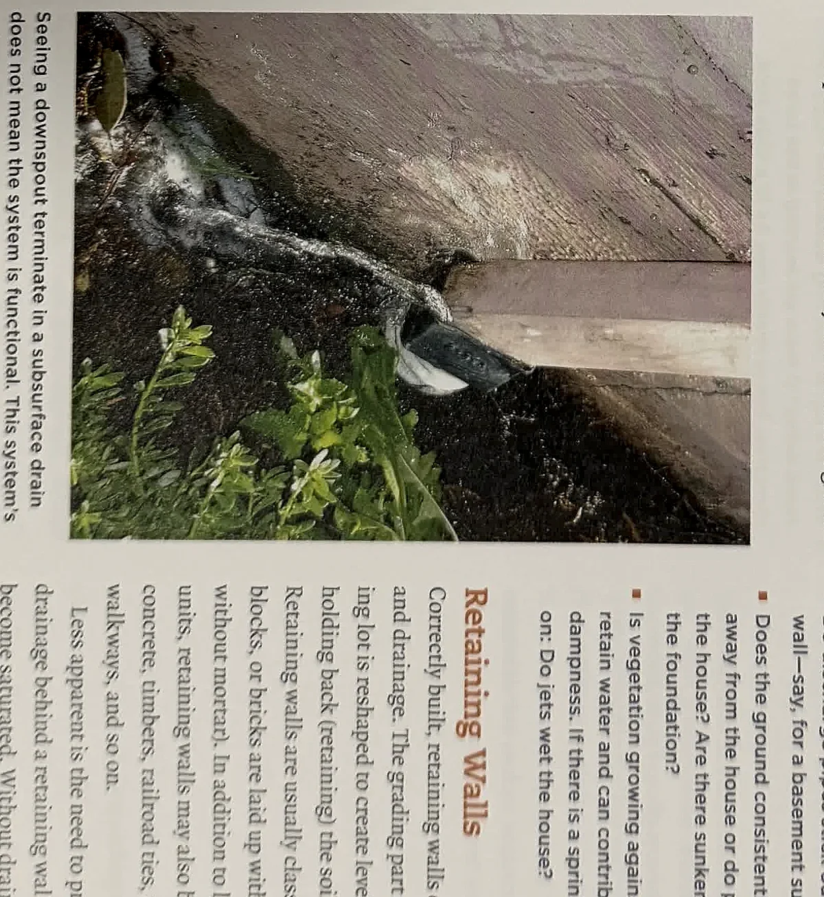 A cropped textbook photo of an exterior retaining wall or drainage area.