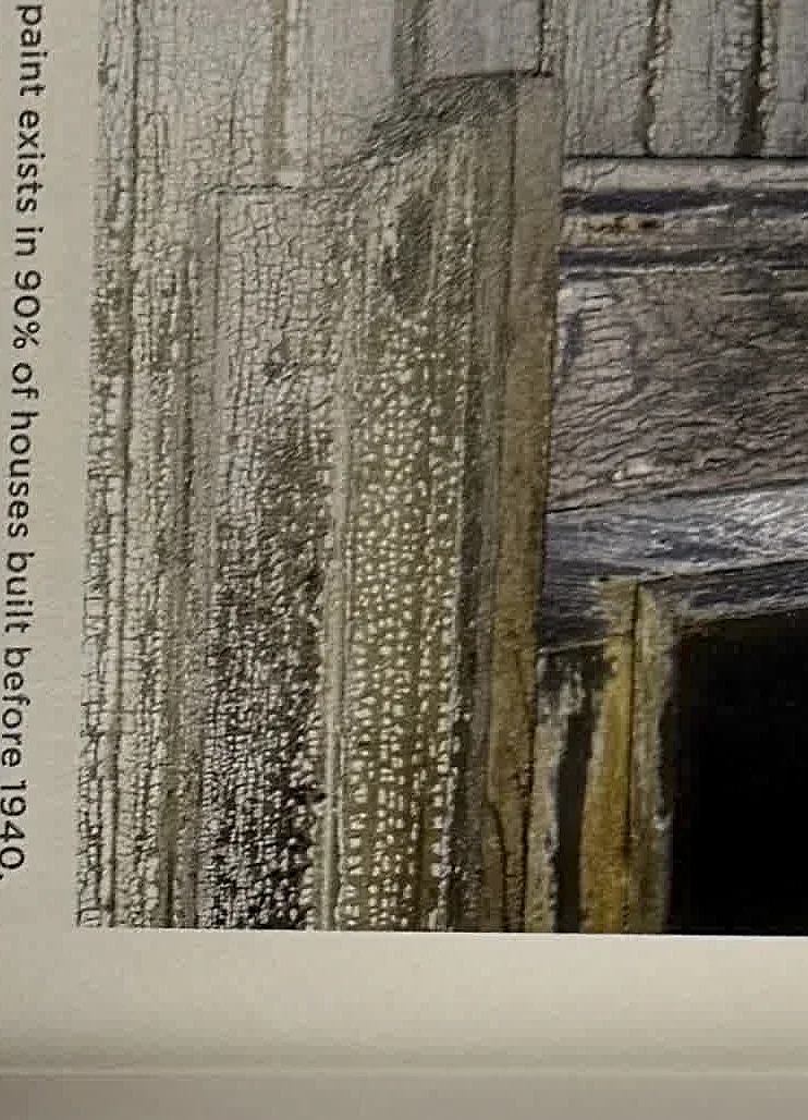 A cropped textbook photo of weathered wood siding.