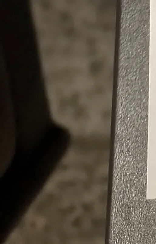 A cropped textbook photo showing masonry and flashing near an exterior opening.