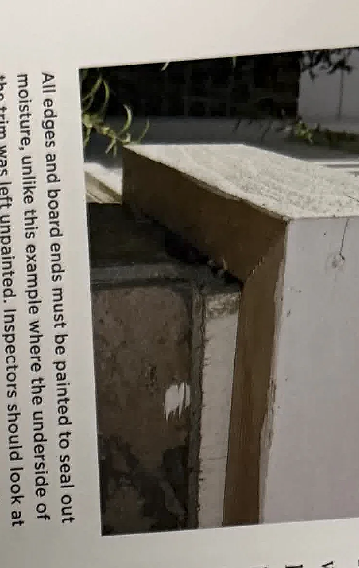 A cropped textbook photo showing an exterior post or trim area.
